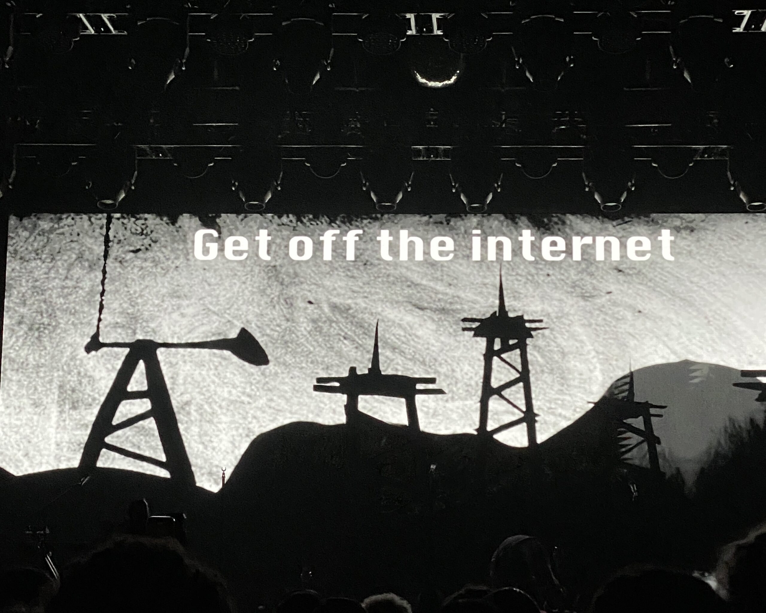 Screen at Le Tigre concert that says "Get Off The Internet"